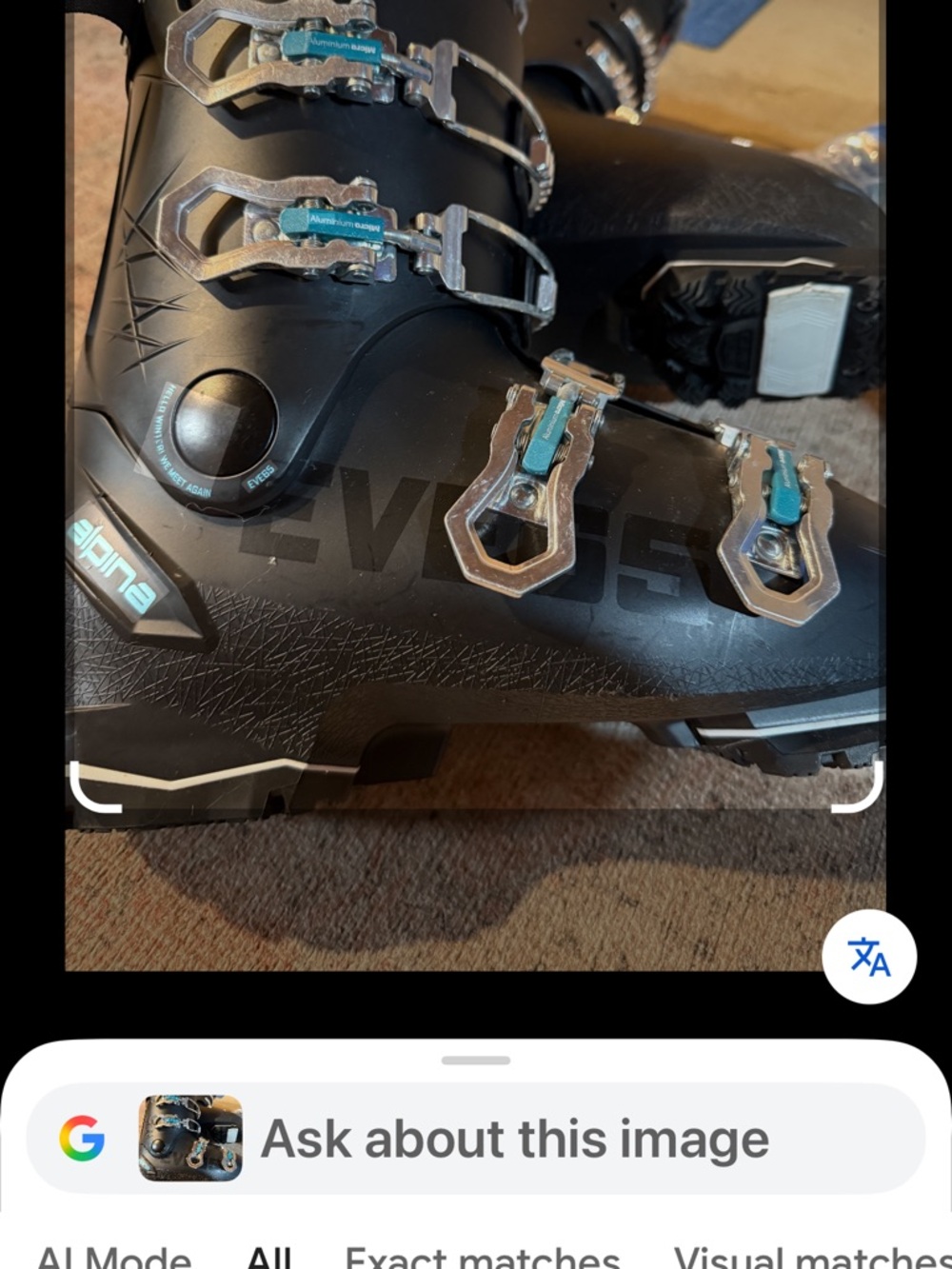 Women's Black Ski Boots with Teal Buckle Accents